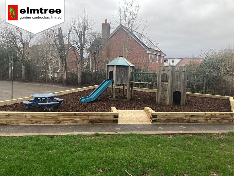 Playground built by Elmtree including a slide and a bench